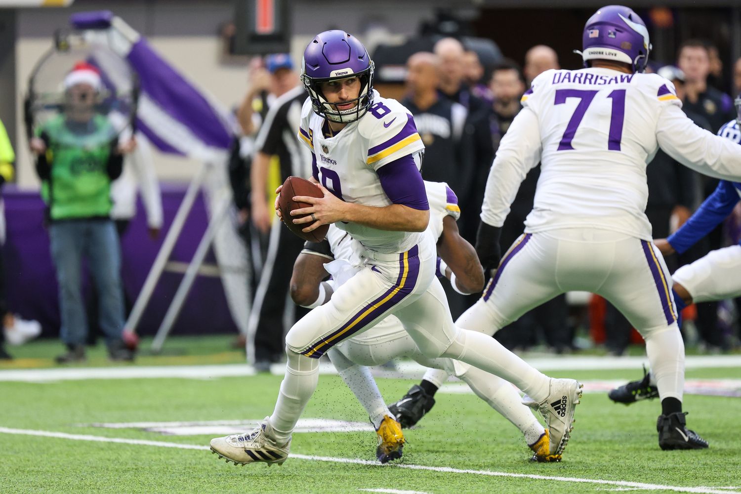 Dec 24, 2022; Minneapolis, Minnesota, USA; Minnesota Vikings quarterback Kirk Cousins (8) drops to pass against the New York Giants during the first quarter at U.S. Bank Stadium.